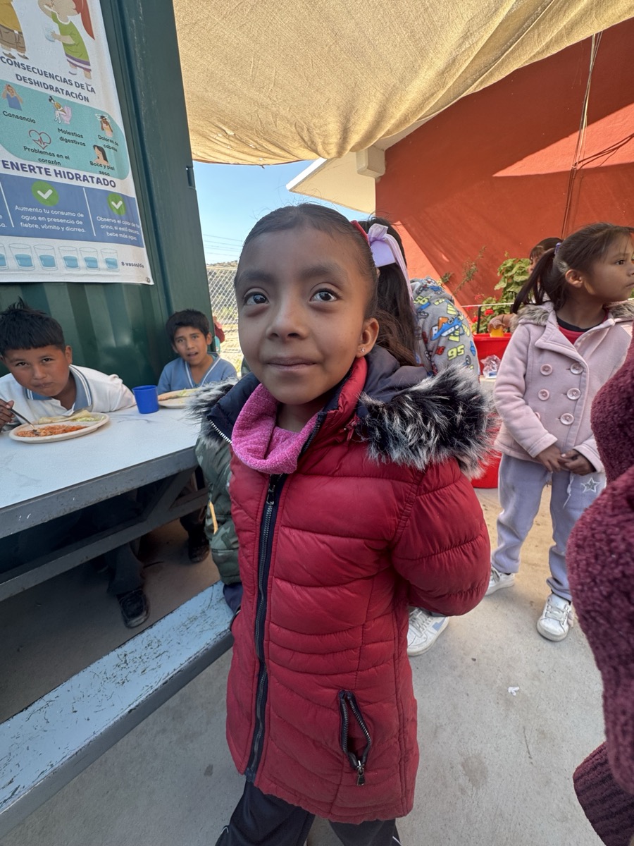 Girl smiling at Feed the Hungry school in San Miguel de Allende