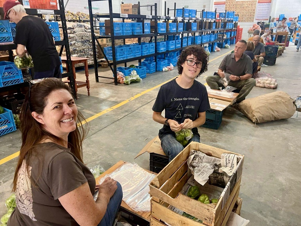 Volunteers packing food at Feed the Hungry warehouse in San Miguel